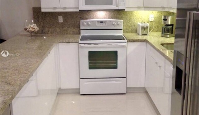 Oversized Condominium with many amenities. Steps to the beach and park