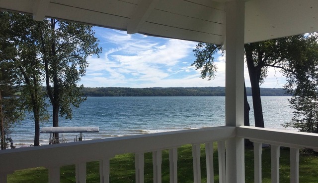 Owasco Lake front seasonal cottage with level yard and beach