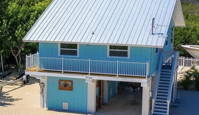PADGETT PARADISE with Two Boat Slips with Filet Table. POOL