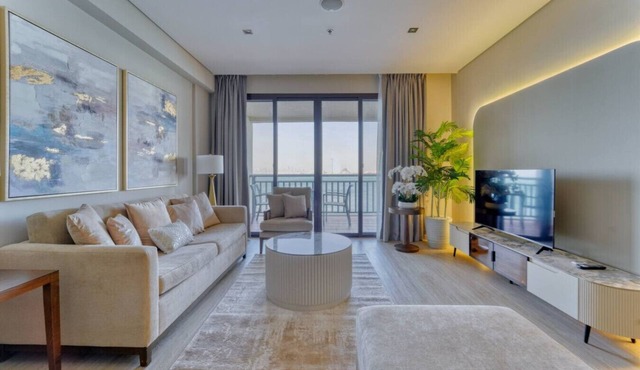 Palm Paradise 1BR | Beachfront Escape w/Pool, Gym, Parking & Balcony