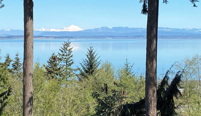 Panoramic View House of Puget Sound with hot tub and walls of windows