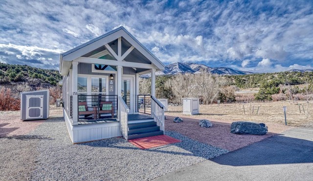 Park Model Cabin - Twin Loft - One queen bed in the private bedroom, with two twin beds in the open loft.