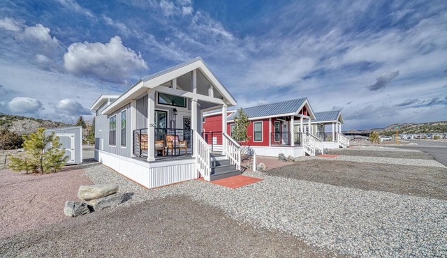 Park Model Cabin with Queen Loft - One queen bed in the private bedroom and one queen bed in the open loft.