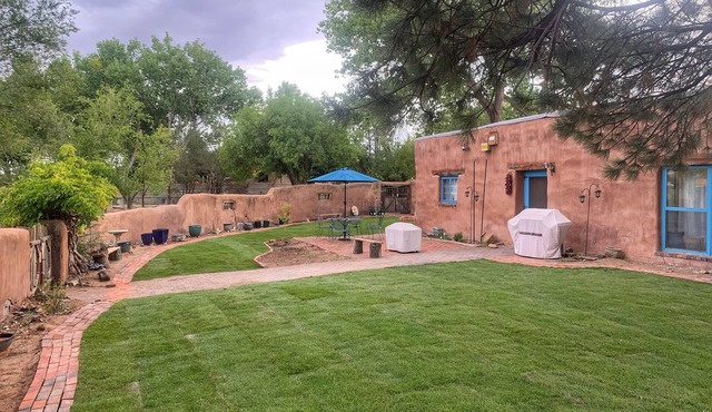 Peaceful artisan adobe with view of the Sandias