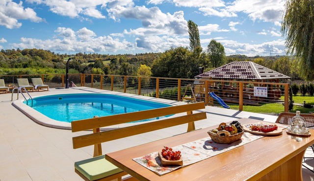 Peaceful countryside retreat with pool, jacuzzi, sauna, tennis, and river views.