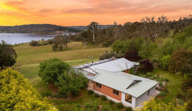 Peaceful farmhouse retreat with breathtaking lake views—charm meets tranquility✨