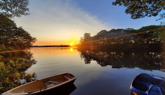 Peaceful lakefront home with panoramic views, private dock and beach.