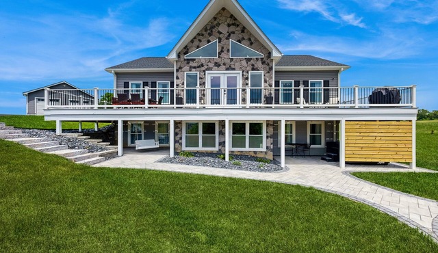 Peaceful retreat with hot tub, fire pit, games, kayaks, and water view