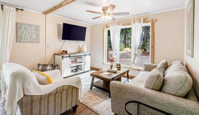 Peaceful, Riverfront, Dog-friendly Home w/ Covered Deck & Outdoor Fire Place!