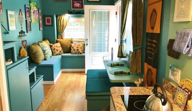 Peaceful Secret Gardens Tiny Home - loft & stairs lead to a Queen Size Bed