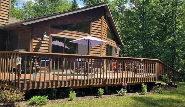 Peaceful Wooded Retreat Offering Immediate Access to all Trails and Area Lakes!