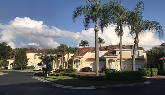 Pelican Bay, Lambiance Garden Condo, second floor with full lake western view.