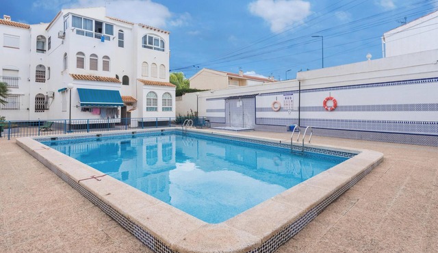 Penthouse Apartment Near the Beach with Sea View, Pool, Wi-Fi, A/C & Terrace