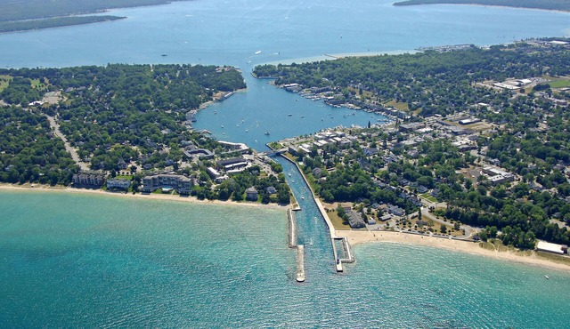 Penthouse Condo on the channel. Stunning views, walk to beach, watch the boats.