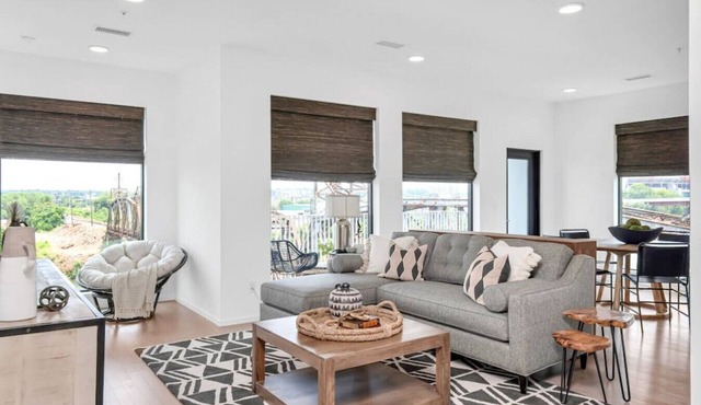 Penthouse Condo with a River View - Walk to Downtown + Garage Parking