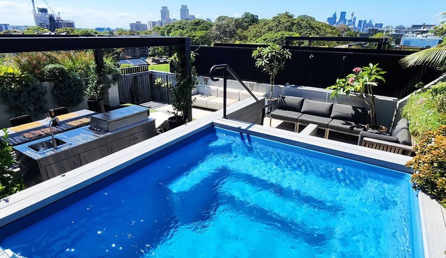 Penthouse perfection with private rooftop pool paradise. 2 bed, 2 bath, parking