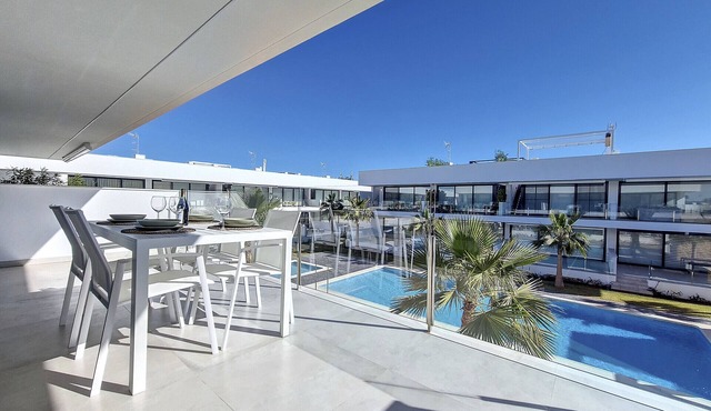 Penthouse with roof terrace and pool views