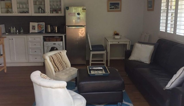 Pet friendly coastal retreat with ocean views. 5 min walk from beach.