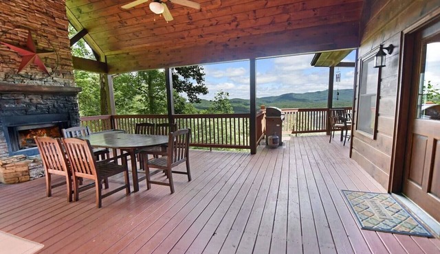 Pet-friendly, mountain view cabin rent with an outdoor fireplace, hot tub and pool table. Free WiFi