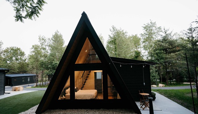 Pine- A-frame cabin nestled on the Woods & Co Weddings + Events property