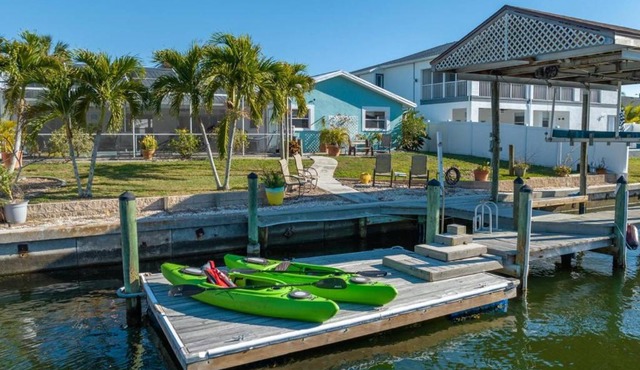 Pirates Den a 4BR Pet-Friendly Waterfront Oasis with Pool, Dock, Personal Water Boats, Fire Pit, Game Room and Bar
