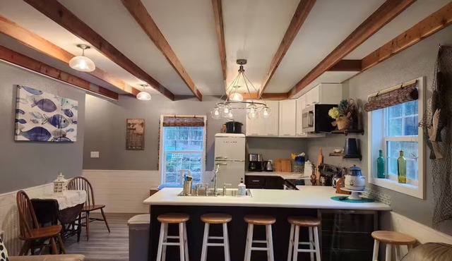 Pixys Place, forest setting overlooking Lake with pool.