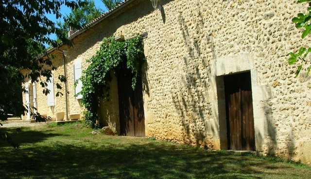 Pleasant stone house surrounded by woods and meadows