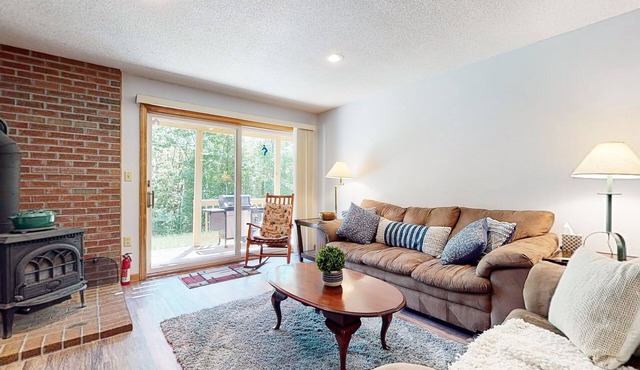 Pleasant dog-friendly condo with wood stove, gas grill, pool, & kitchen