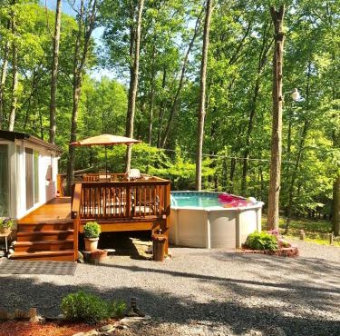 Pocono cabin with hot tub and private pool at Shawnee Mtn