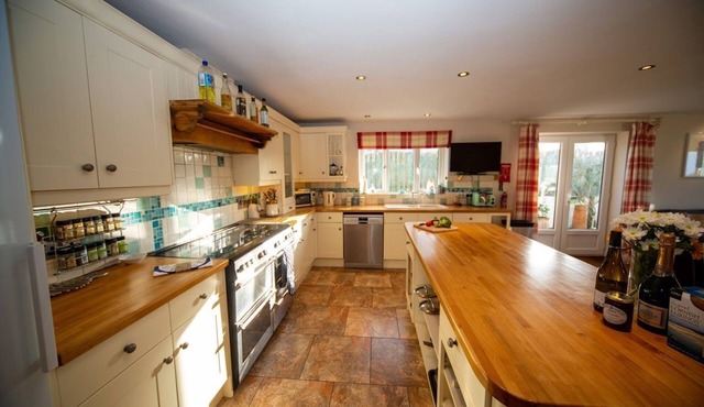 Polcarrek contemporary holiday home with parking and garden. Balcony with rural views