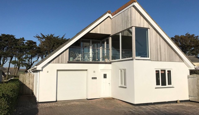 Polcarrek contemporary holiday home with parking and garden. Balcony with rural views