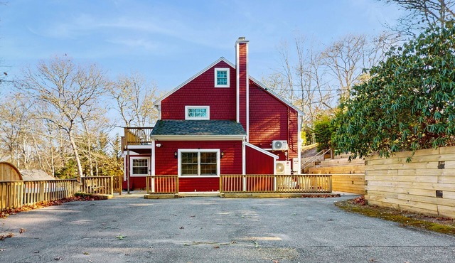 Pondfront escape with private beach, hot tub, sauna, play area & dog-friendly