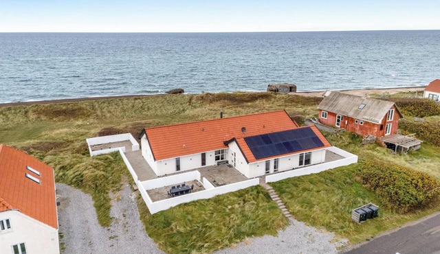 Pool and activity house with a 180-degree view of the North Sea, located at.