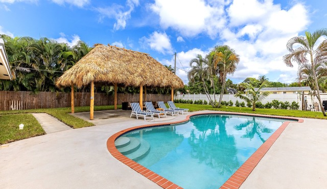 Pool Home W Beautiful Tiki Hut - 3 Bed 3 Bath. 1 mile from beach!
