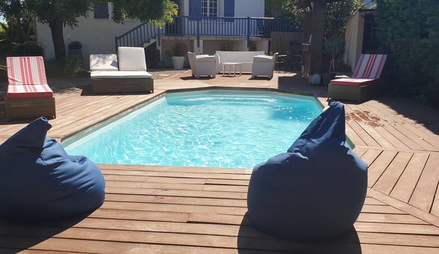 Pool house surrounded by vineyards