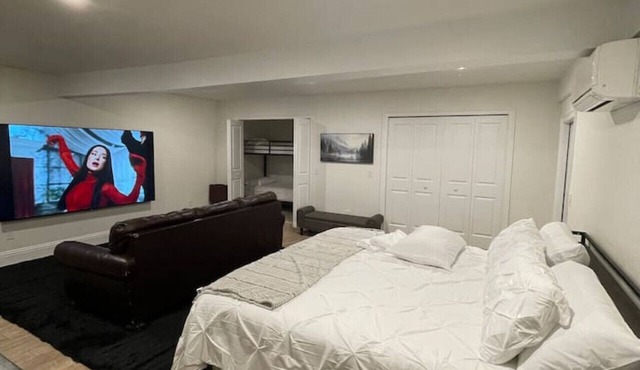 Poolside Suite | 98” TV | Sleeps 7 | 3 Rooms