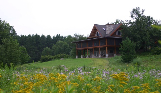 Premium log home on 600+ private wooded acres with private lake and waterfront