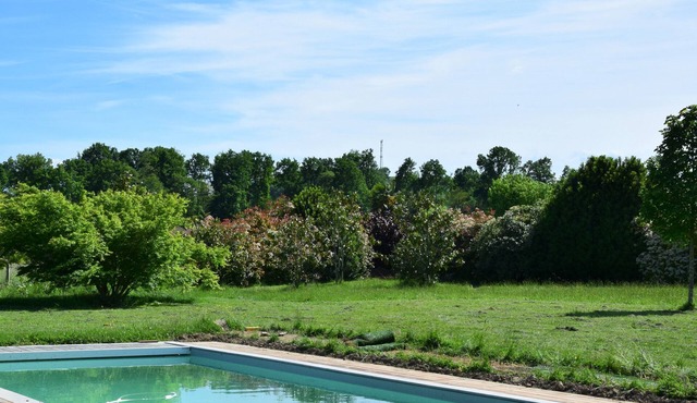 Pretty villa with a large swimming pool in lush greenery