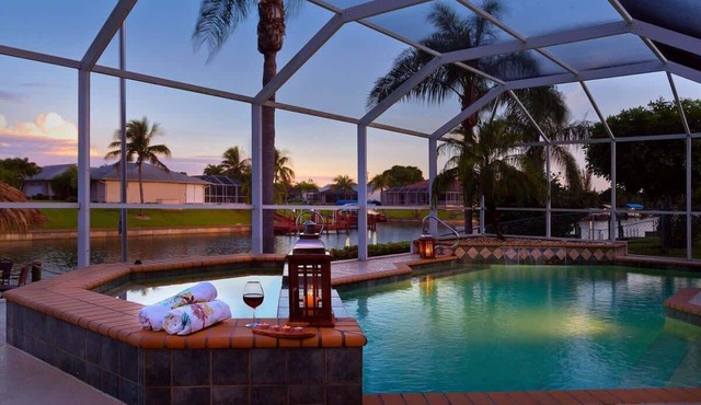 Pretty Waterfront Home w/Heated Pool/Spa + Tiki