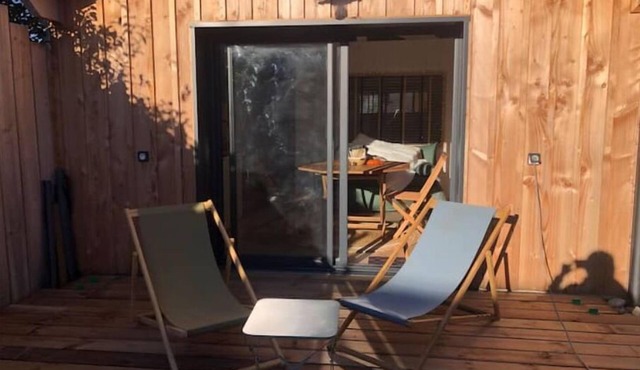 pretty wooden shed with terrace