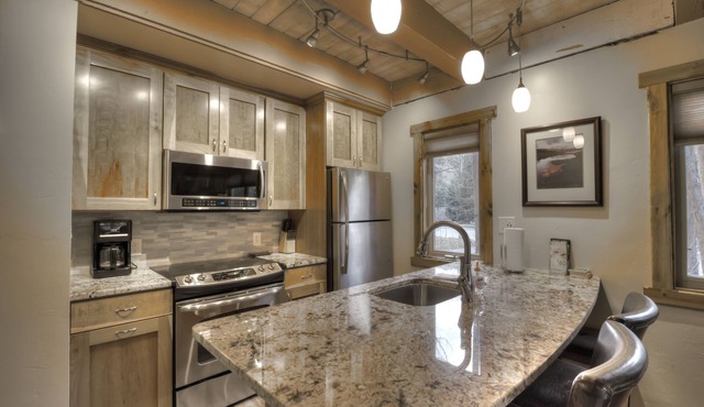 Prime Location <> Beautiful Interior <> Heated Floors <> 90 Steps to Lift & Town