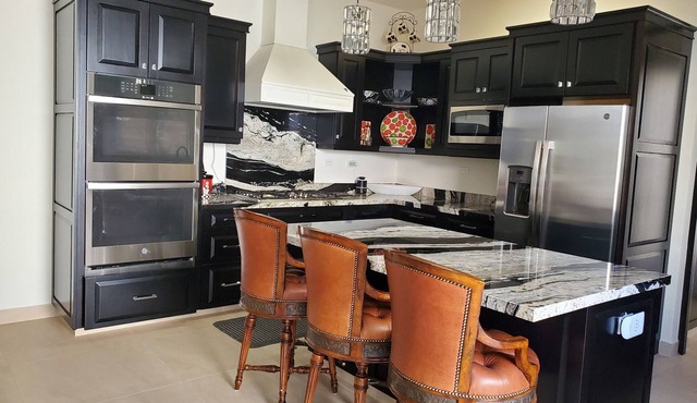 Pristine 3-bed, 3.5-bath villa with mountain, golf course, sea views & hot tub n