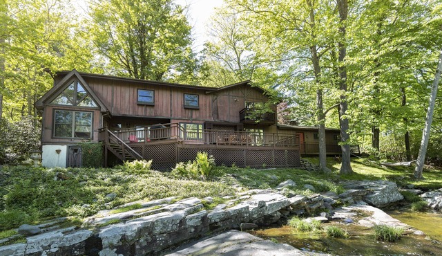 Private 10-Acre Creekside Cabin—80-Ft Deck, Fire Pit, Wildlife & Cozy Spaces!