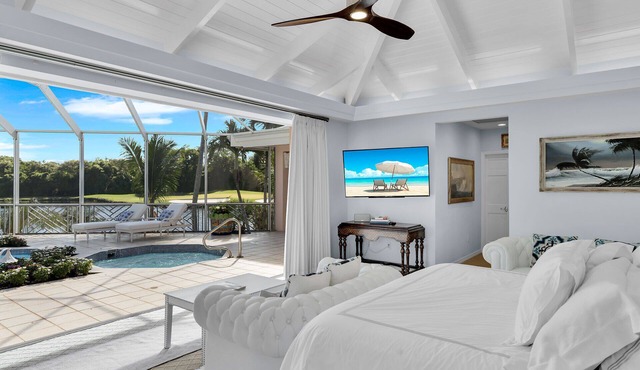 Private 5 BR Ocean Reef Estate overlooking pond and The Hammock Golf Course.