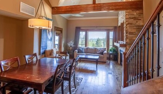 Private Balcony | Stunning Wood Accented Living Room | Walk-in Shower and Deep Soaker Tub