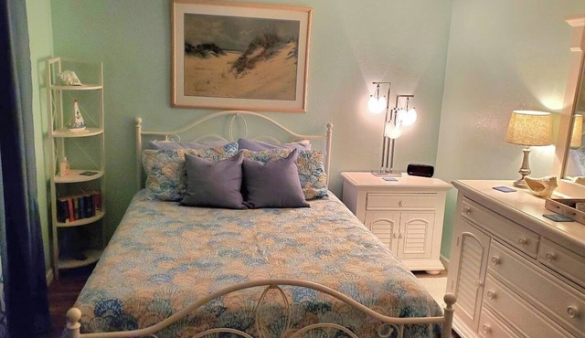 Private bedroom and private bath at separate end of home with water views.