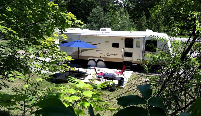 Private Caravan on beautiful 2.5 acre wooded setting close to village and beach