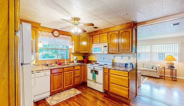 Private community home with on-site pool, screened patio, central AC, & W/D