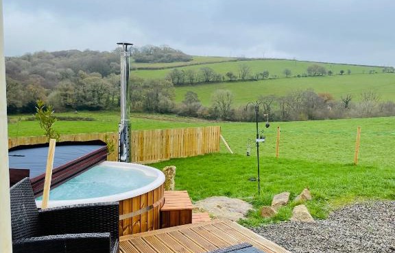 Private country caravan surrounded by fields