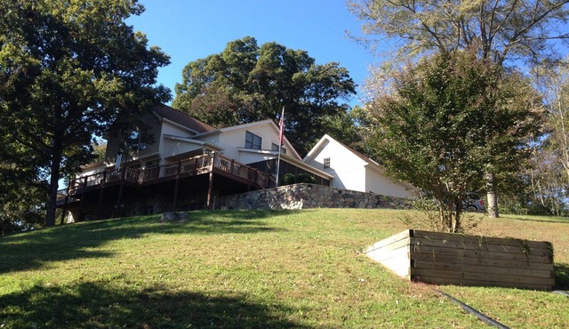 Private country hillside setting surrounded by trees, birds, wildlife pond/falls